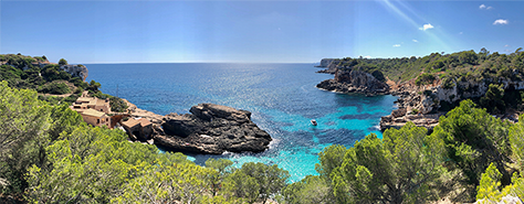 a lush, green island with sandy beaches, surrounded by a blue sea